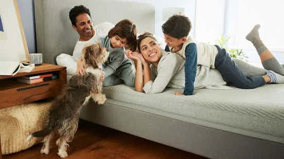 Family snuggling on a Casper mattress
