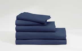 Flat lay of sateen sheets in various colors