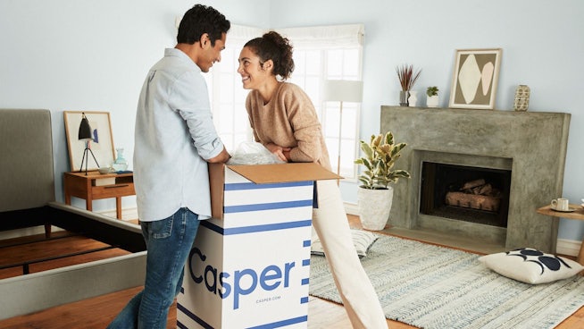 Couple unboxing a Casper mattress