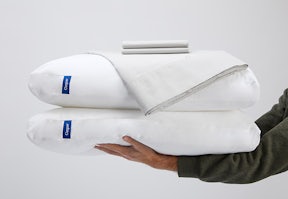 Sheet set stacked on top of 2 pillows