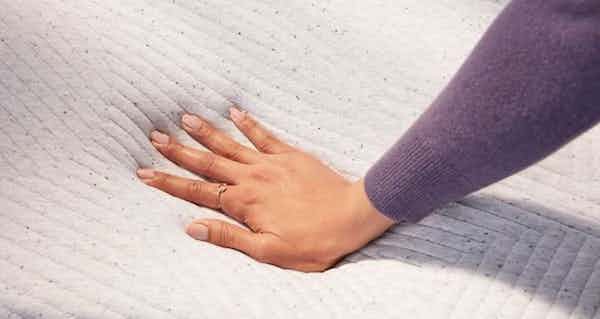 original hybrid mattress with hand pushing down